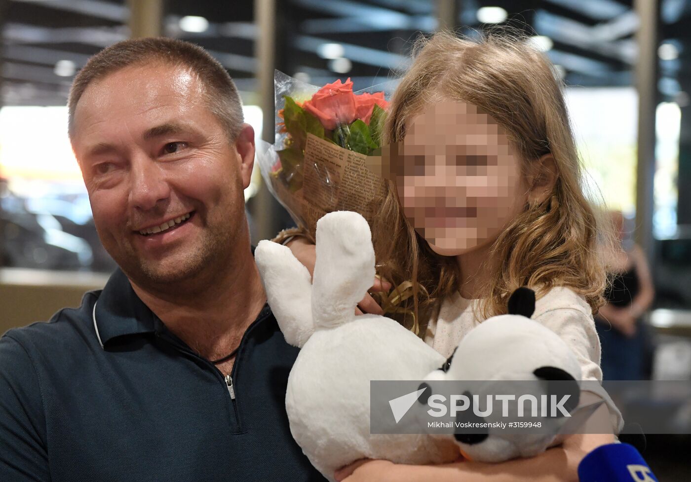 Sergei Ukhanov and his daughter Liza arrive in Moscow