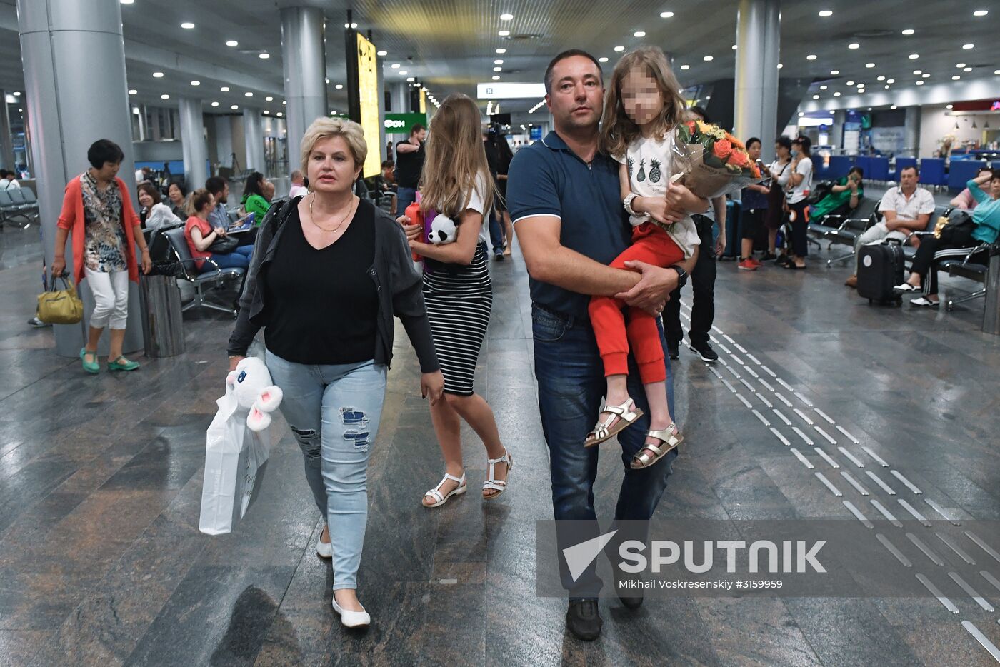 Sergei Ukhanov and his daughter Liza arrive in Moscow