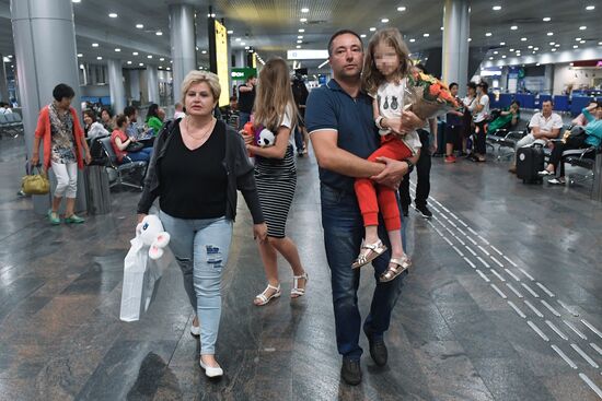 Sergei Ukhanov and his daughter Liza arrive in Moscow