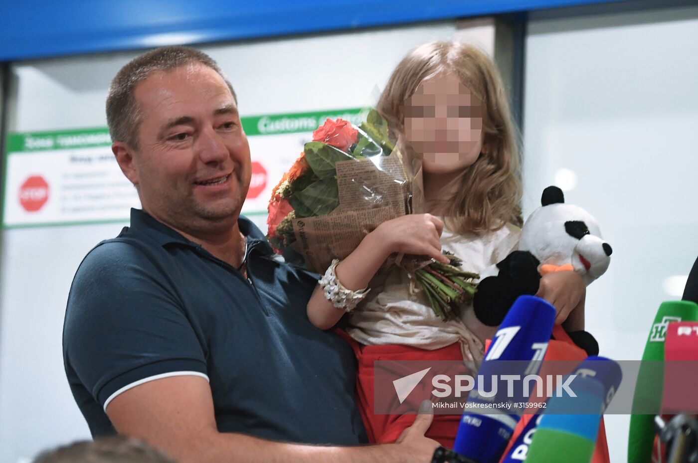 Sergei Ukhanov and his daughter Liza arrive in Moscow