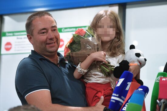 Sergei Ukhanov and his daughter Liza arrive in Moscow