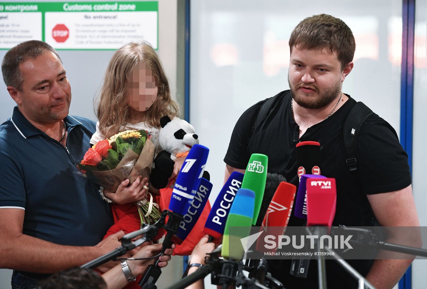Sergei Ukhanov and his daughter Liza arrive in Moscow