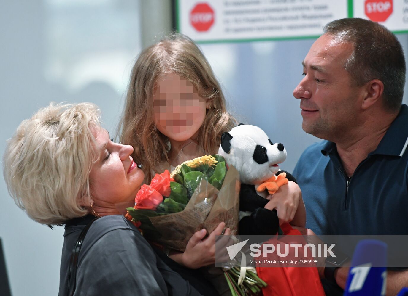 Sergei Ukhanov and his daughter Liza arrive in Moscow