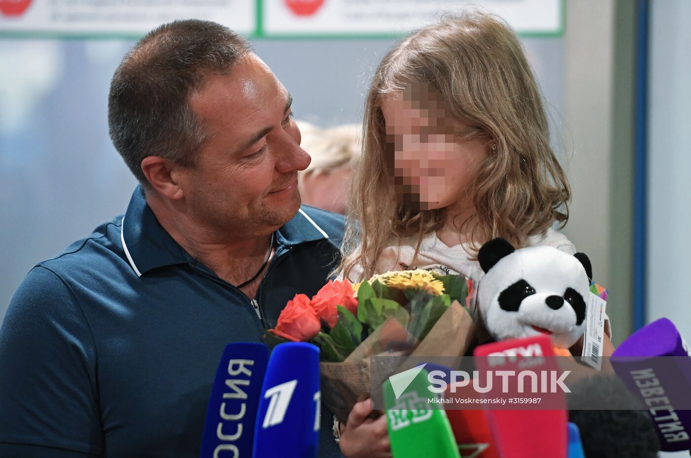 Sergei Ukhanov and his daughter Liza arrive in Moscow