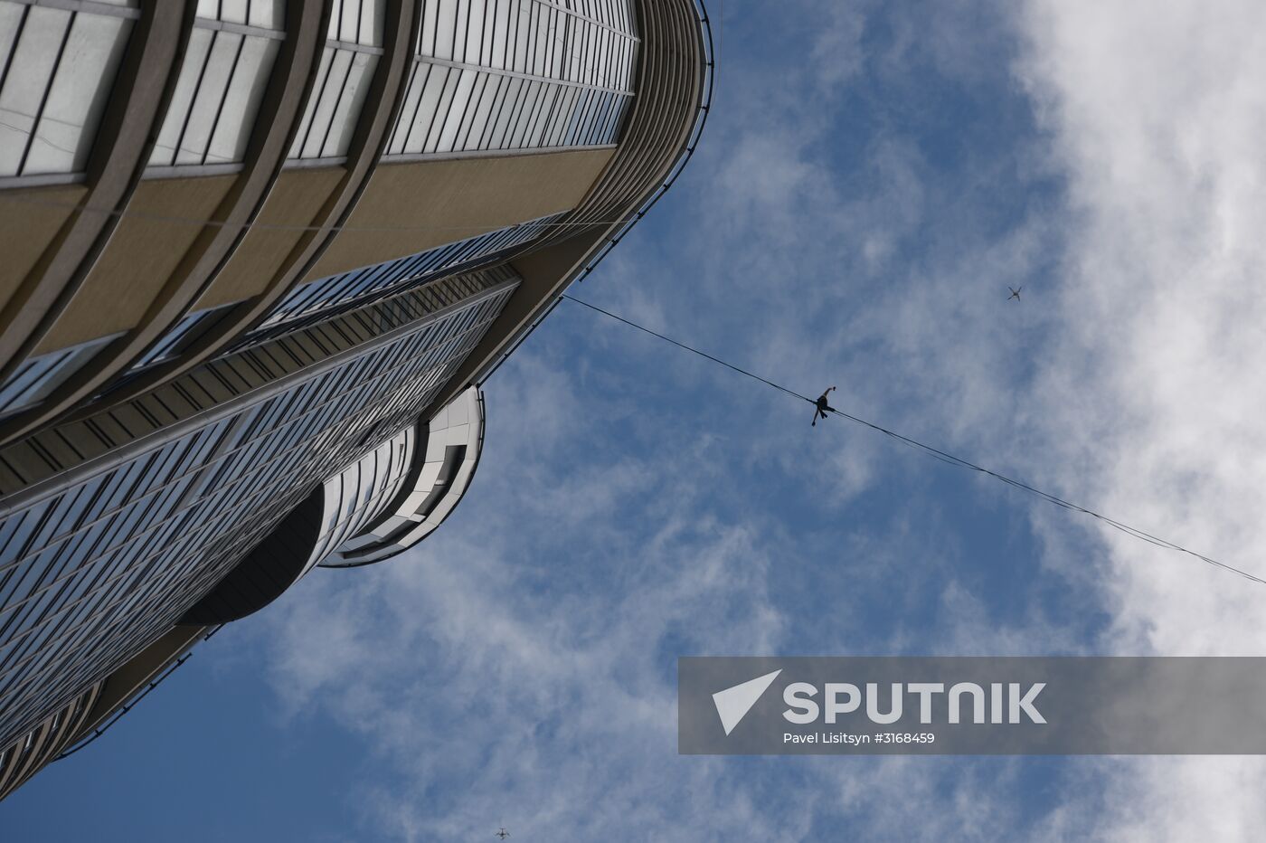 Tightrope walker Maxim Kagin walks between two skyscrapers in Yekaterinburg