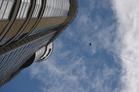 Tightrope walker Maxim Kagin walks between two skyscrapers in Yekaterinburg