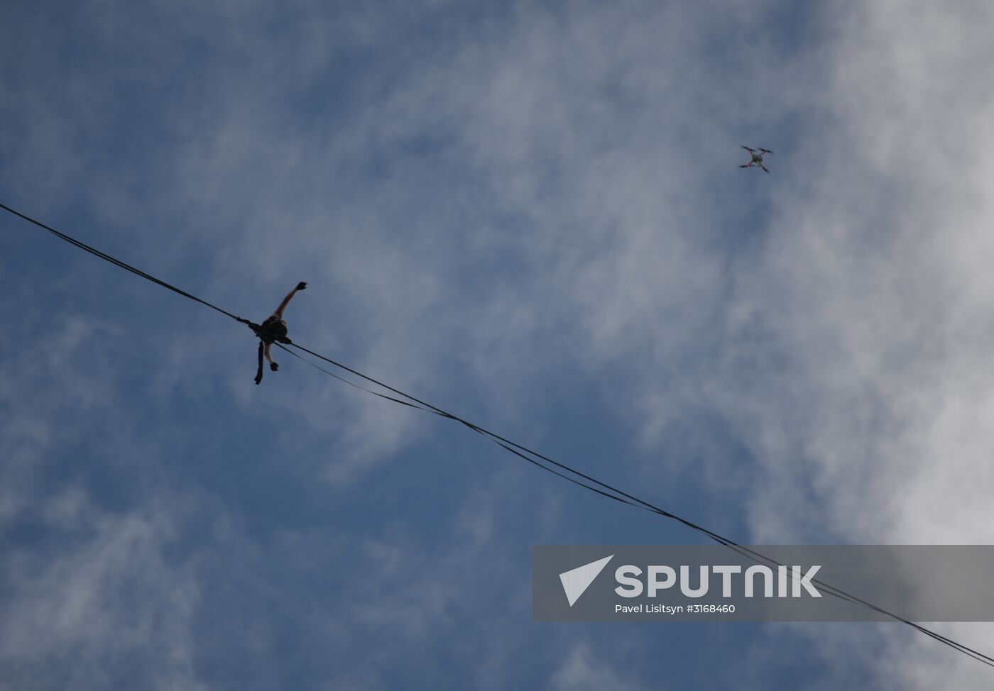 Tightrope walker Maxim Kagin walks between two skyscrapers in Yekaterinburg