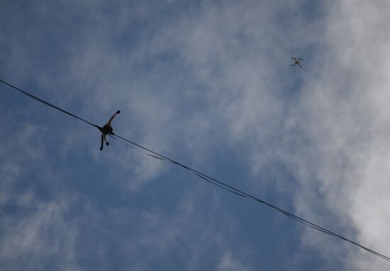 Tightrope walker Maxim Kagin walks between two skyscrapers in Yekaterinburg