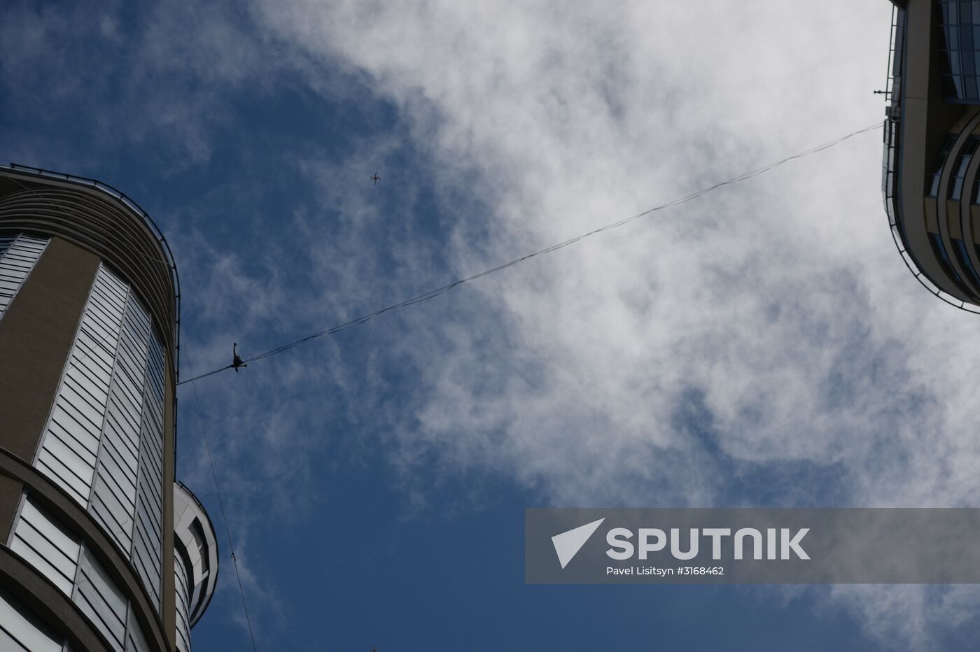 Tightrope walker Maxim Kagin walks between two skyscrapers in Yekaterinburg
