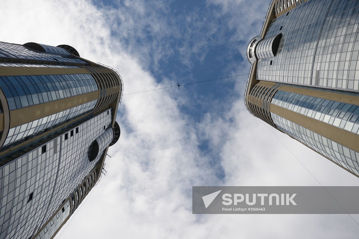 Tightrope walker Maxim Kagin walks between two skyscrapers in Yekaterinburg