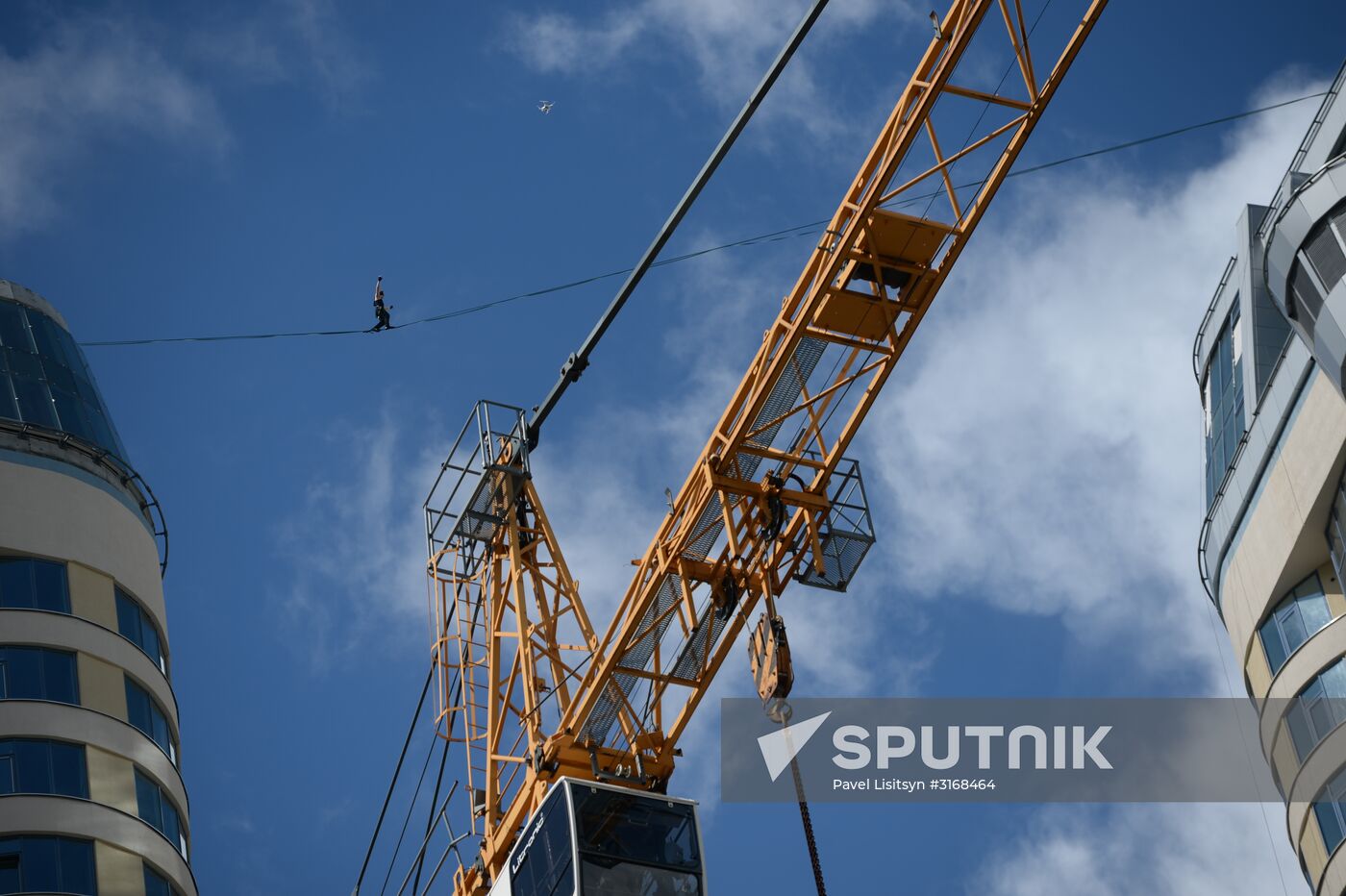 Tightrope walker Maxim Kagin walks between two skyscrapers in Yekaterinburg