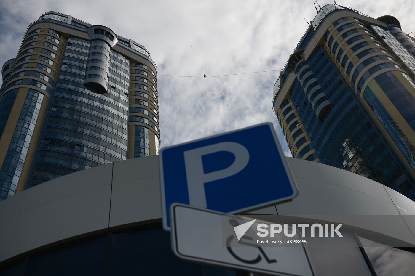 Tightrope walker Maxim Kagin walks between two skyscrapers in Yekaterinburg
