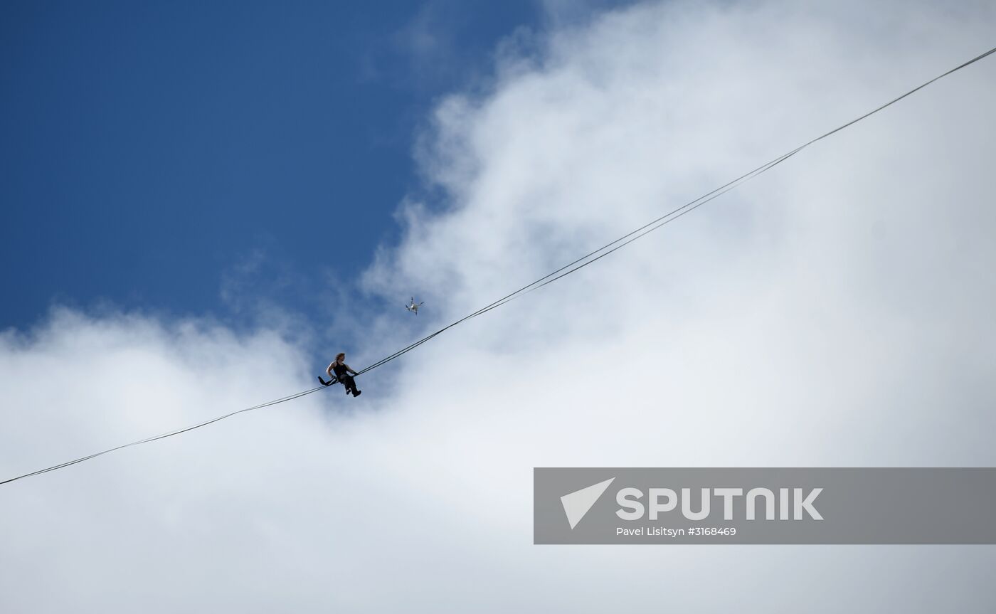 Tightrope walker Maxim Kagin walks between two skyscrapers in Yekaterinburg