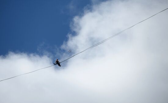 Tightrope walker Maxim Kagin walks between two skyscrapers in Yekaterinburg