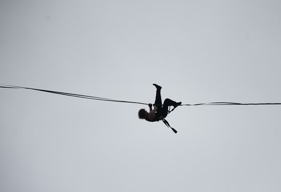 Tightrope walker Maxim Kagin walks between two skyscrapers in Yekaterinburg