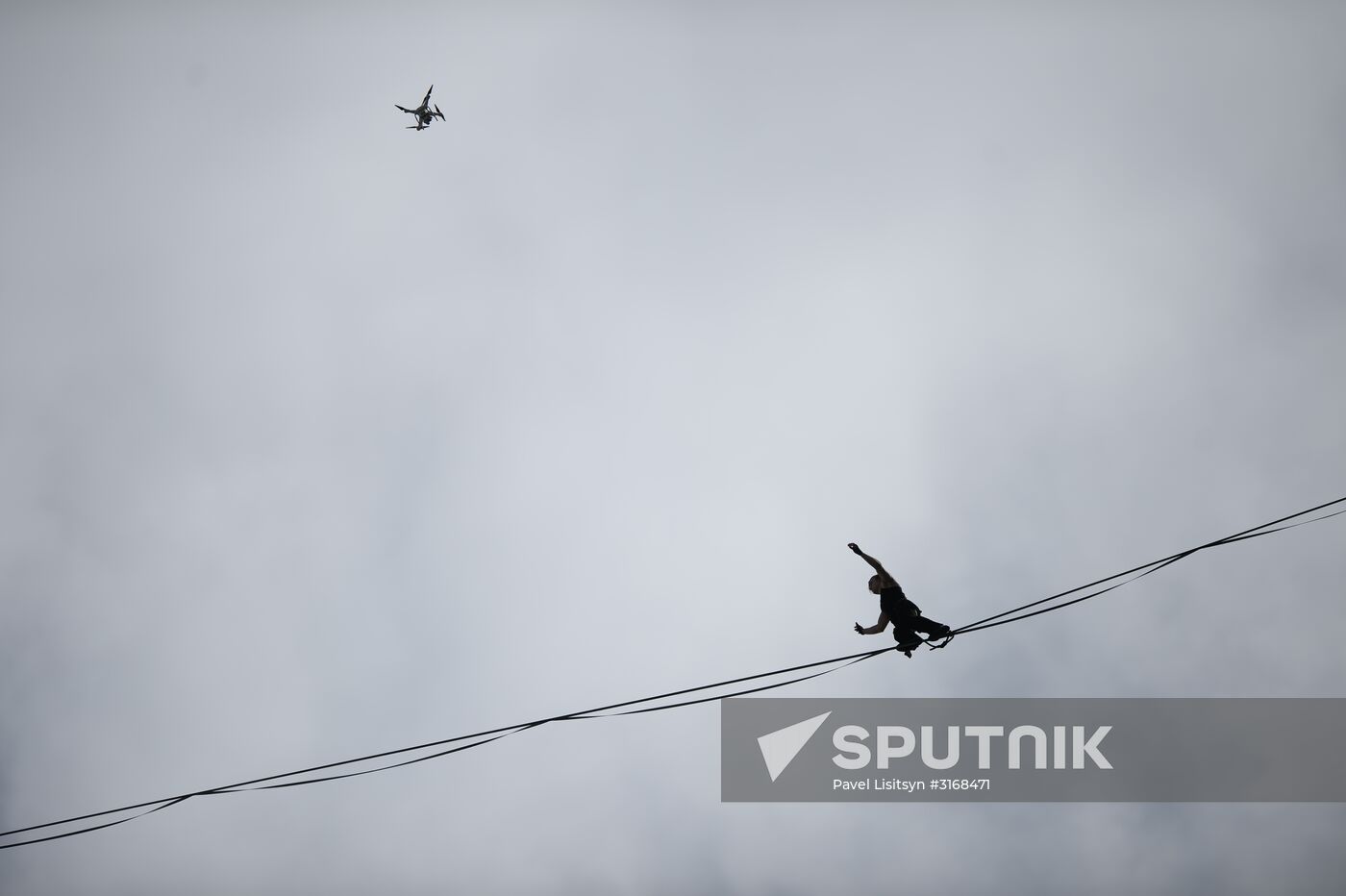 Tightrope walker Maxim Kagin walks between two skyscrapers in Yekaterinburg