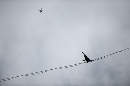 Tightrope walker Maxim Kagin walks between two skyscrapers in Yekaterinburg