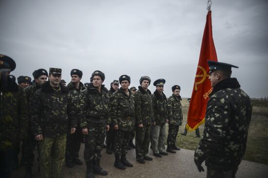 Ukrainian military men negotiate with representatives of Sevastopol self-defense units at Belbek Airbase