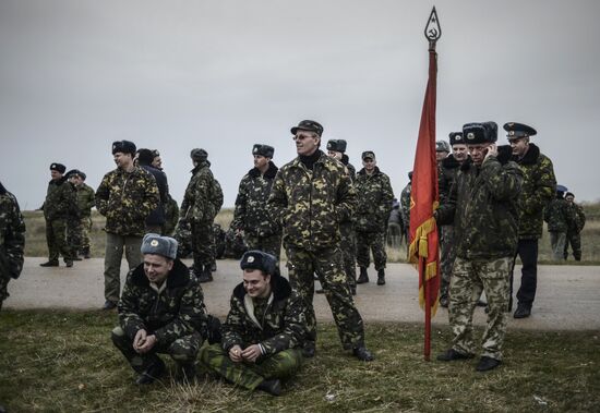 Ukrainian military men negotiate with representatives of Sevastopol self-defense units at Belbek Airbase