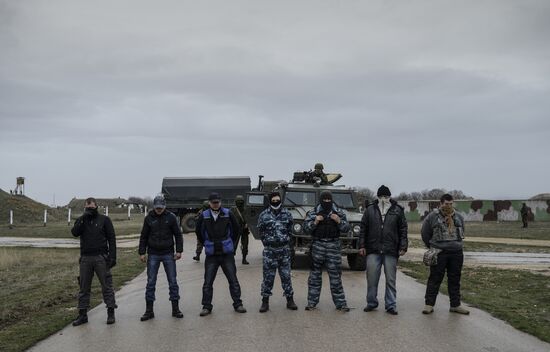 Ukrainian military men negotiate with representatives of Sevastopol self-defense units at Belbek Airbase