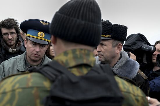 Ukrainian military men negotiate with representatives of Sevastopol self-defense units at Belbek Airbase