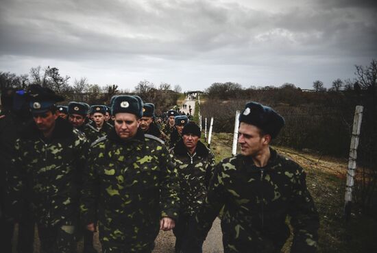 Ukrainian military men negotiate with representatives of Sevastopol self-defense units at Belbek Airport