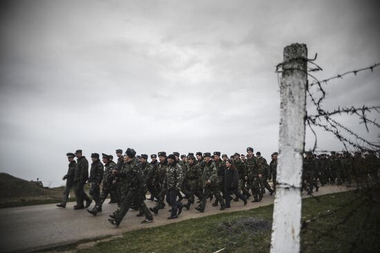Ukrainian military men negotiate with representatives of Sevastopol self-defense units at Belbek Airport