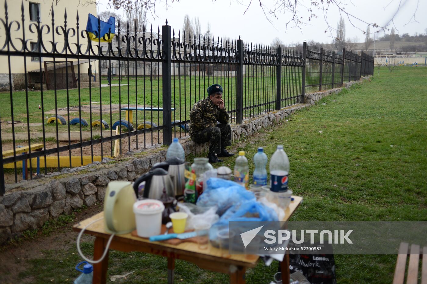 Ukrainian military men negotiate with representatives of Sevastopol self-defense units at Belbek Airport