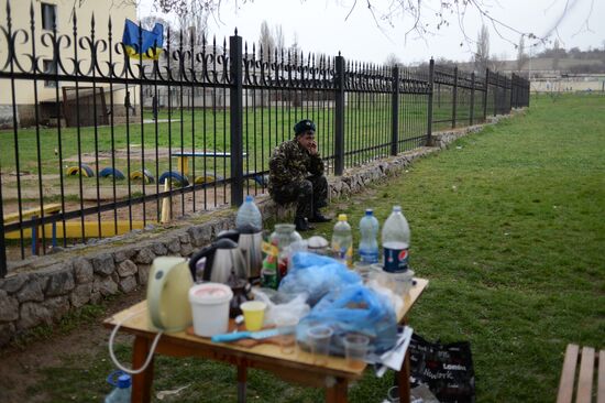 Ukrainian military men negotiate with representatives of Sevastopol self-defense units at Belbek Airport