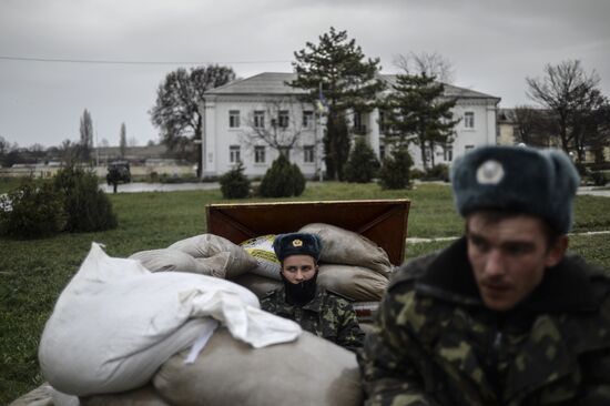 Ukrainian military men negotiate with representatives of Sevastopol self-defense units at Belbek Airport