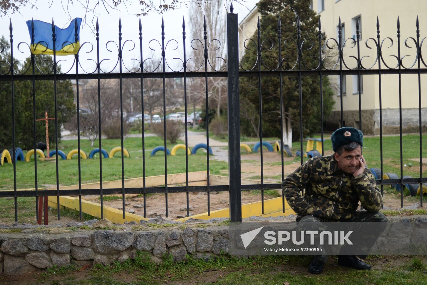 Ukrainian military men negotiate with representatives of Sevastopol self-defense units at Belbek Airbase