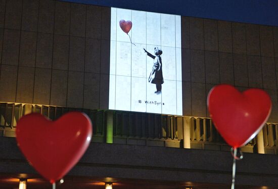 Installation of works by Banksy on a wall in the State Tretyakov Gallery