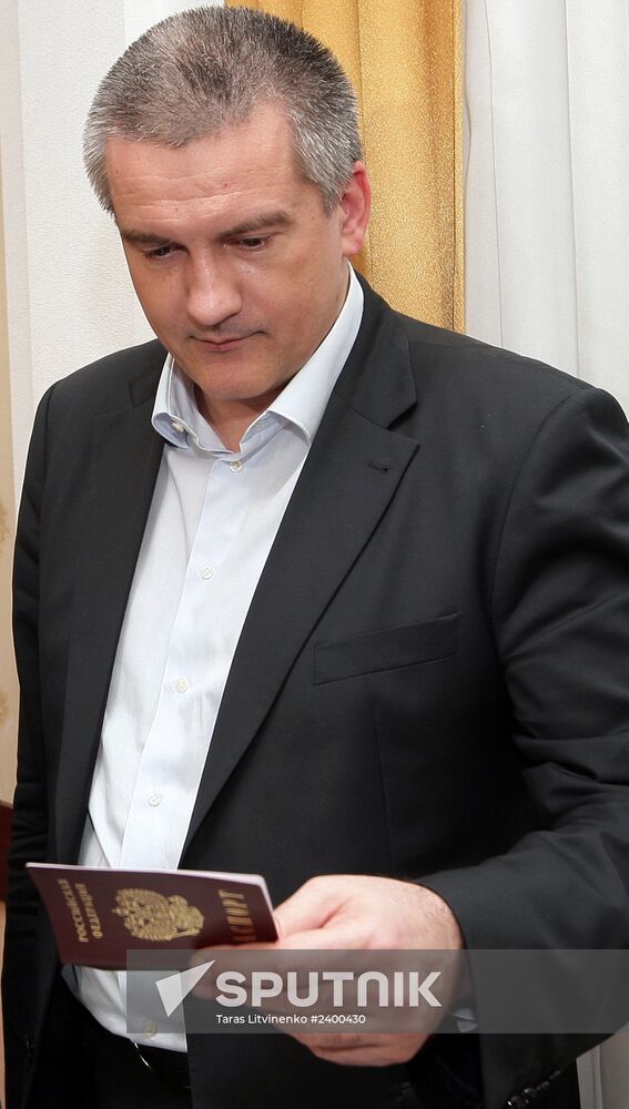 Crimean Prime Minister Sergei Aksyonov gets a Russian passport