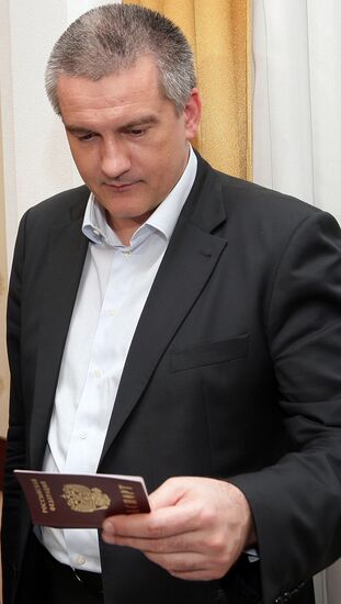 Crimean Prime Minister Sergei Aksyonov gets a Russian passport