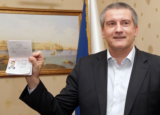Crimean Prime Minister Sergei Aksyonov gets a Russian passport
