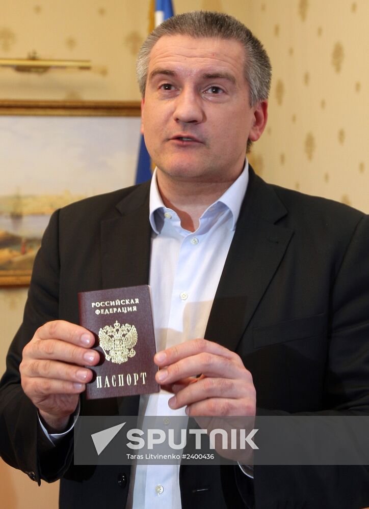 Crimean Prime Minister Sergei Aksyonov gets a Russian passport