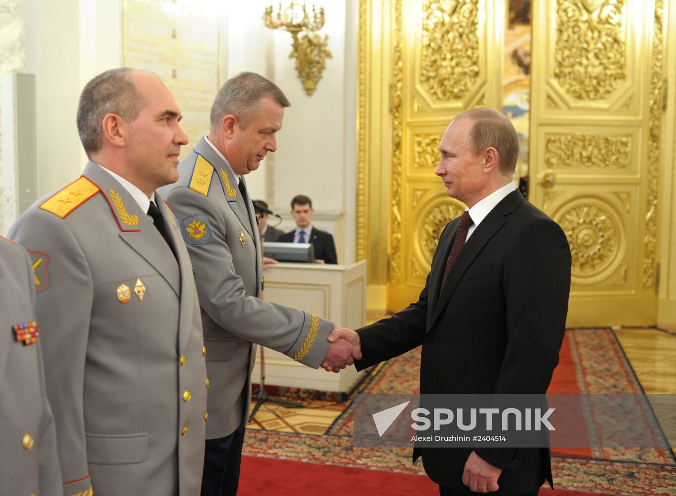 Vladimir Putin attends Kremlin reception presenting senior officers