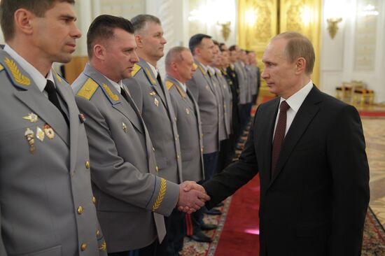 Vladimir Putin attends Kremlin reception presenting senior officers