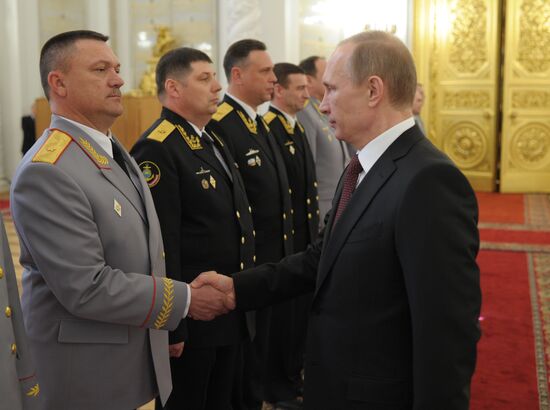 Vladimir Putin attends Kremlin reception presenting senior officers