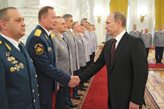 Vladimir Putin attends Kremlin reception presenting senior officers