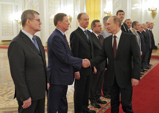 Vladimir Putin attends Kremlin reception presenting senior officers