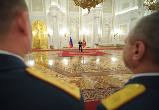 Vladimir Putin attends Kremlin reception presenting senior officers