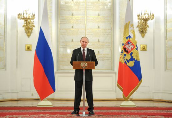 Vladimir Putin attends Kremlin reception presenting senior officers