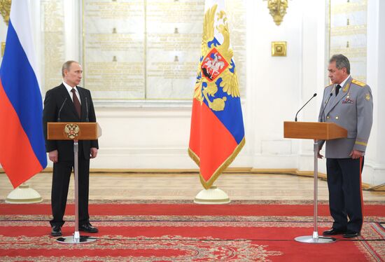 Vladimir Putin attends Kremlin reception presenting senior officers