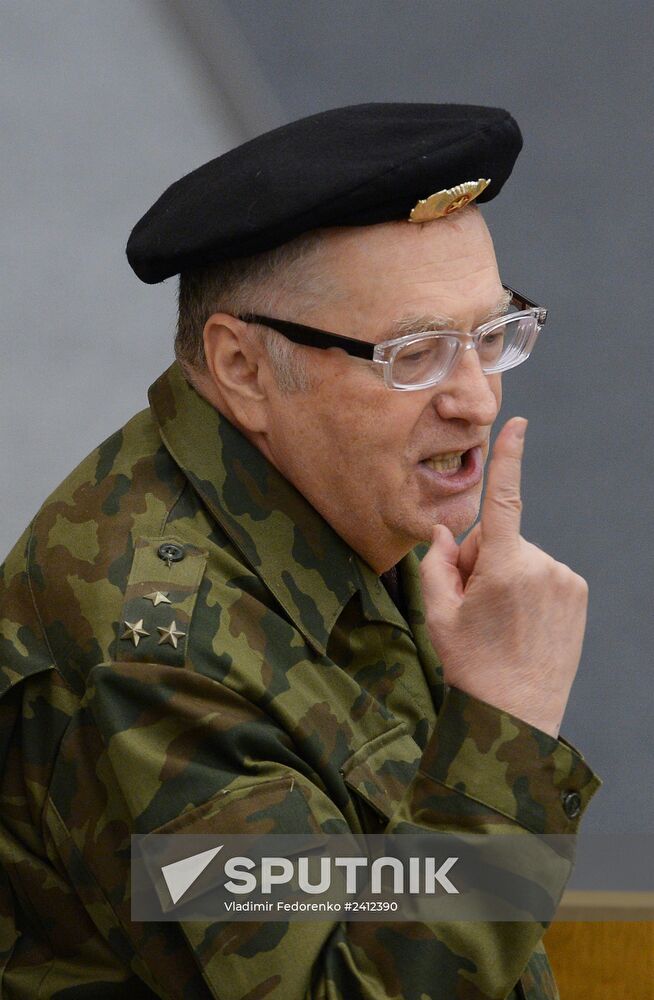 Deputies attend State Duma plenary meeting.