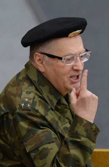 Deputies attend State Duma plenary meeting.