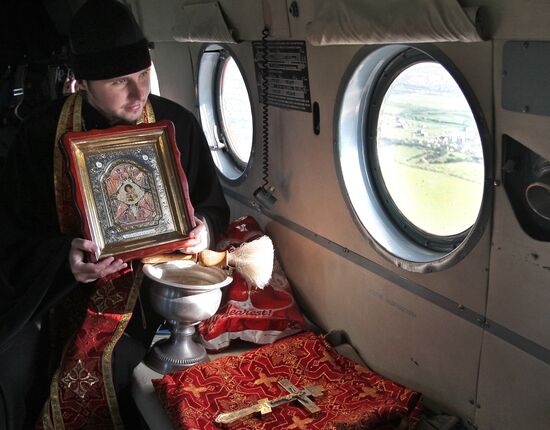 Consecrating Crimean territory from an Emergencies Ministry helicopter