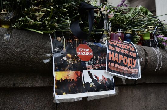 Flowers to commemorate memory of those who died from fire at Odessa's House of Trade Unions