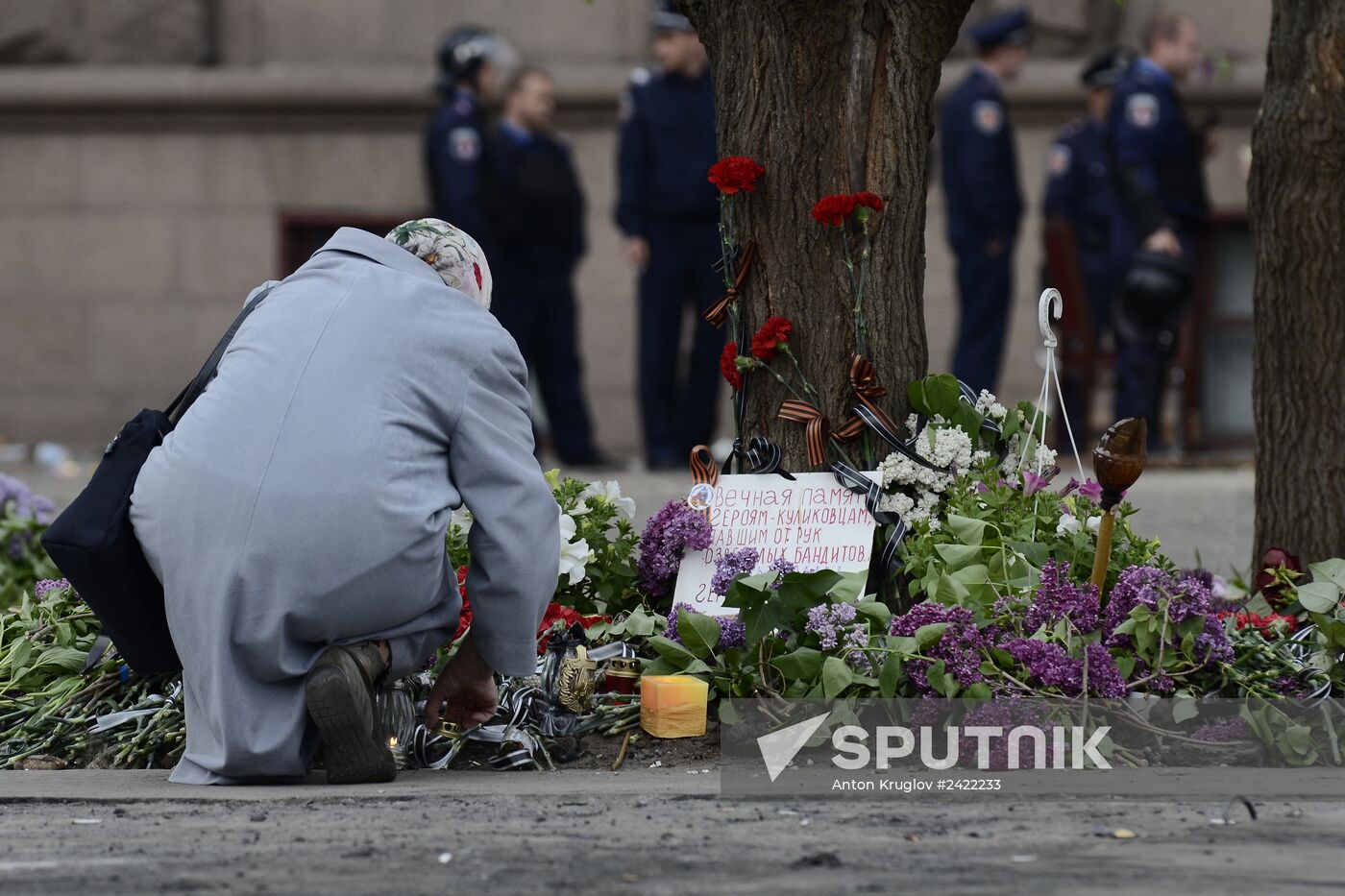 Flowers to commemorate memory of those who died from fire at Odessa's House of Trade Unions