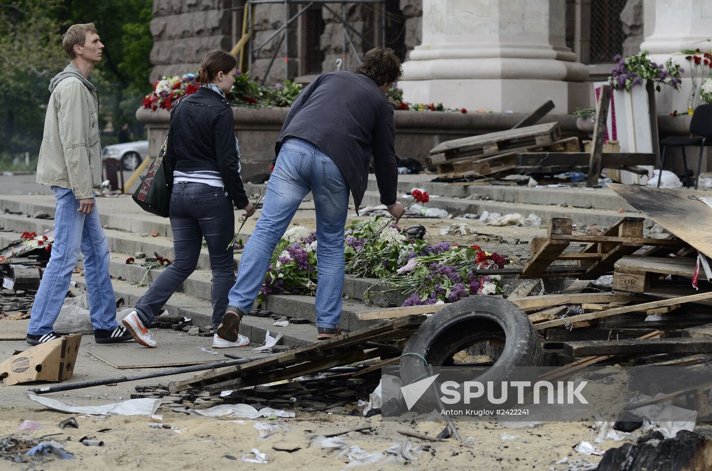 Flowers to commemorate memory of those who died from fire at Odessa's House of Trade Unions